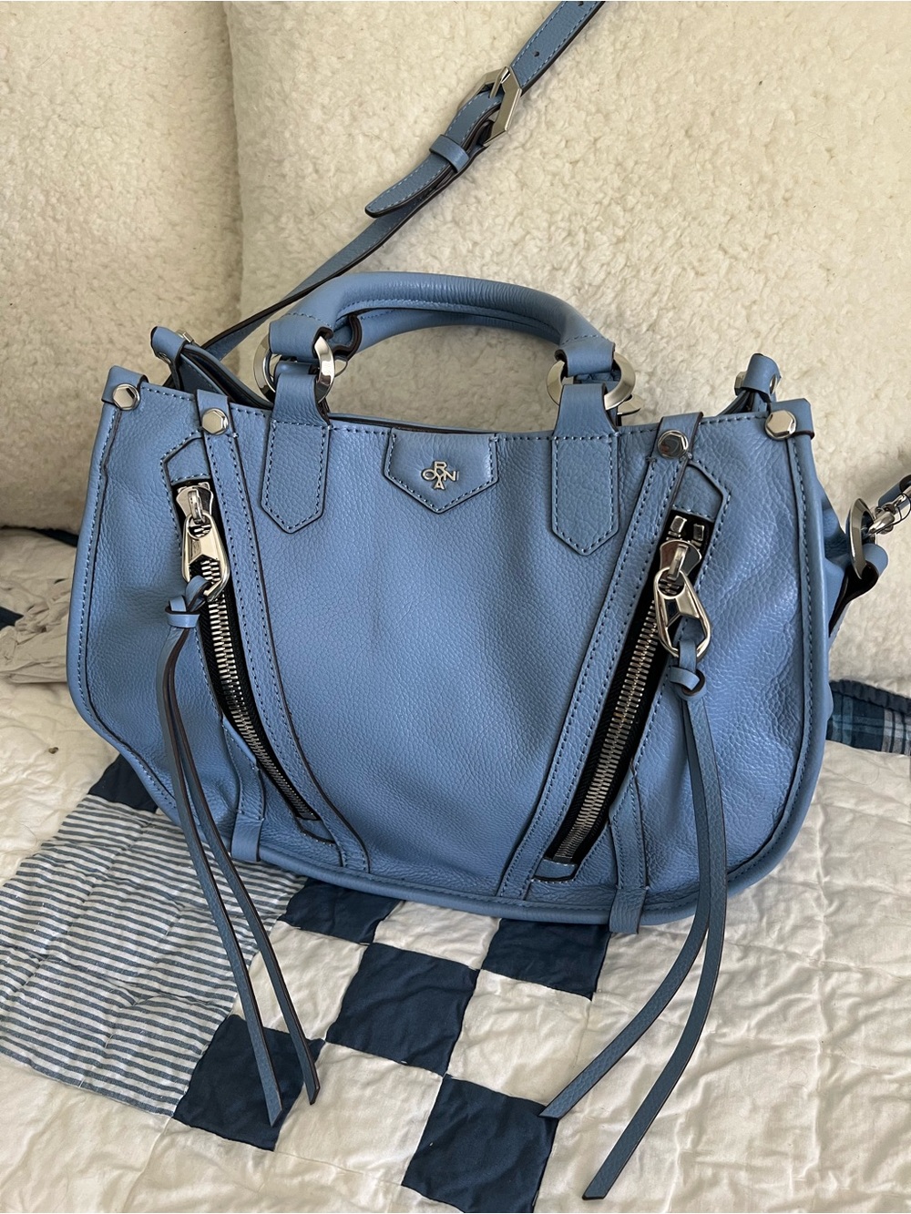 Oryany Leather bag with Silver hardware , snap
Closure, zipper walls inside.
